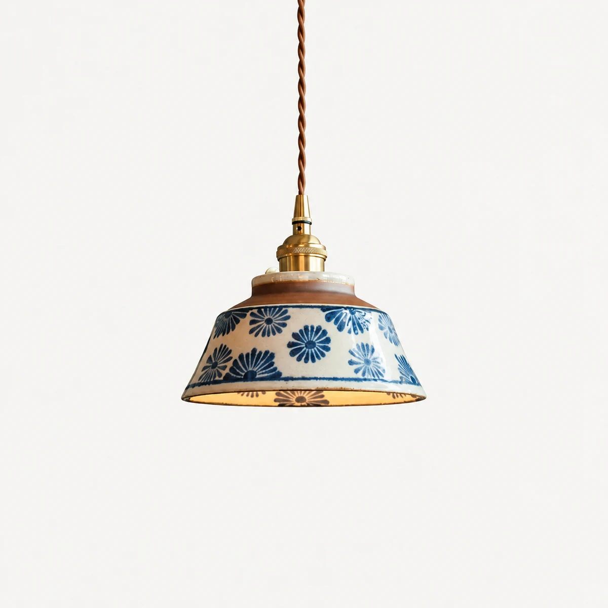 Blue and white hand-painted ceramic pendant lamp with brass-tone socket