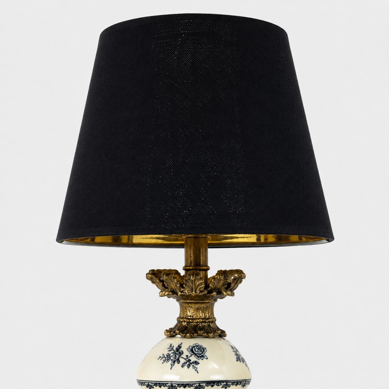 Black fabric shade and brass tone inner rim detail