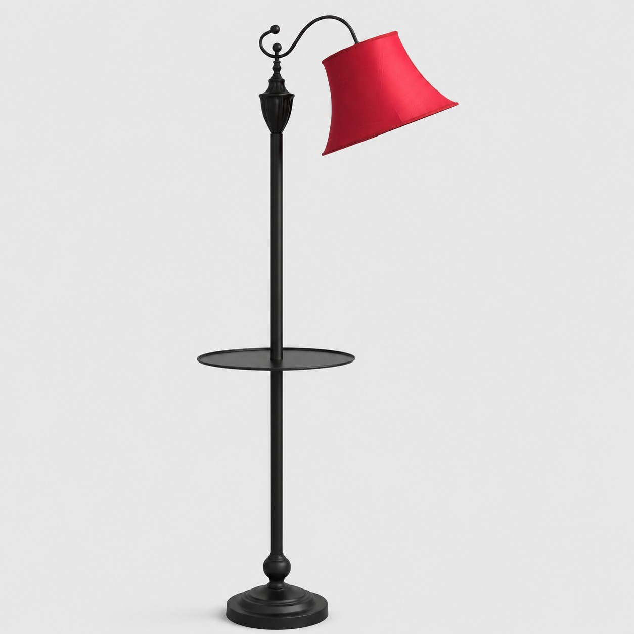 Full view of vintage black arc floor lamp with burgundy fabric shade and round side table